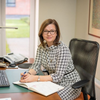 SIVA direktore Ilona Jurševska sēž pie darba galda