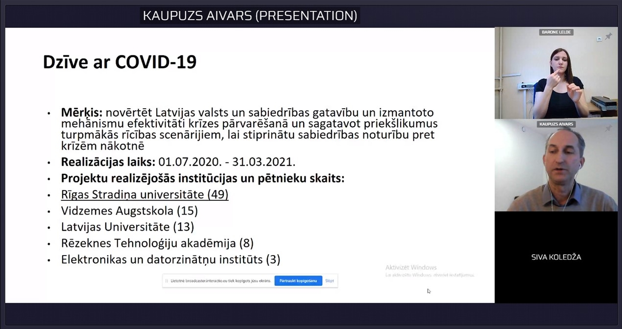 Ekrānšāviņš, kurā redzams slaids "Dzīve ar Covid-19".